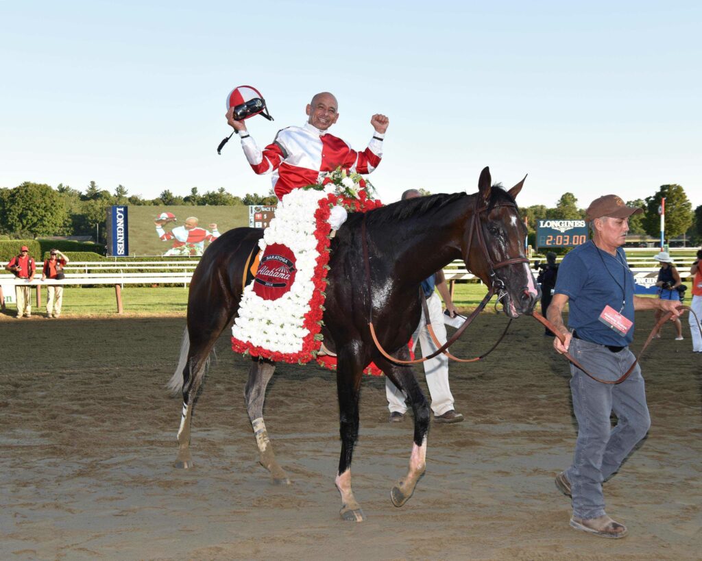 Mike Smith and Songbird celebrate winning the G1 Alabama at Saratoga (Photo Credit: NYRA)